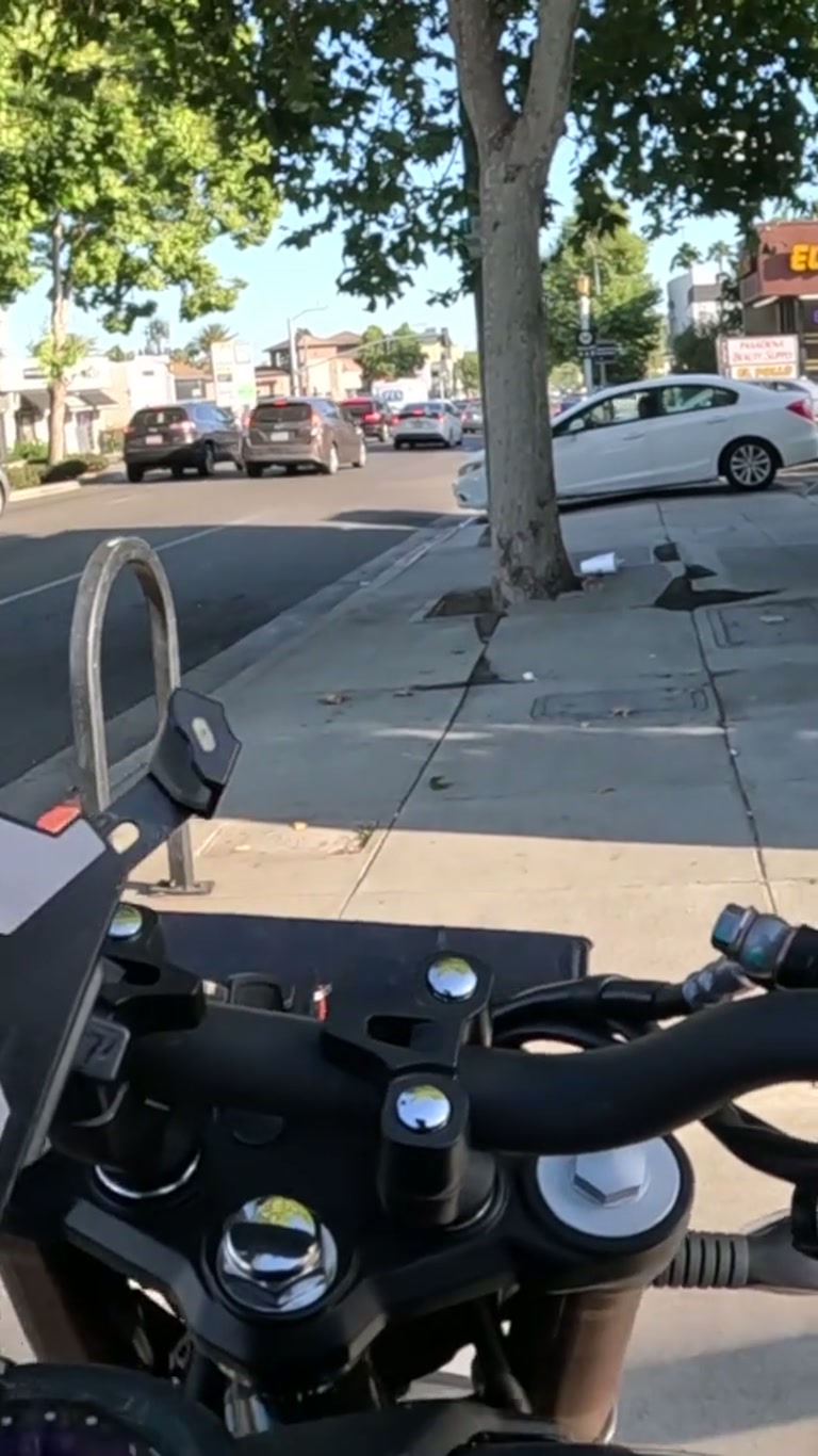Motorcyclist Offers Food to a Man Who Says He Is Very Angry