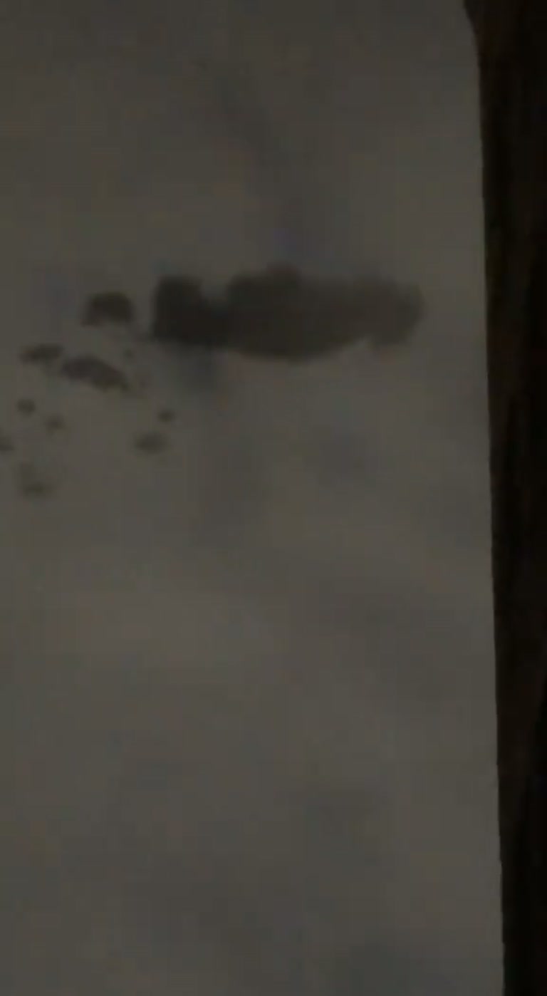 A Dark Shape in a Grey Sky Sparks "Rendering Error" Debate
