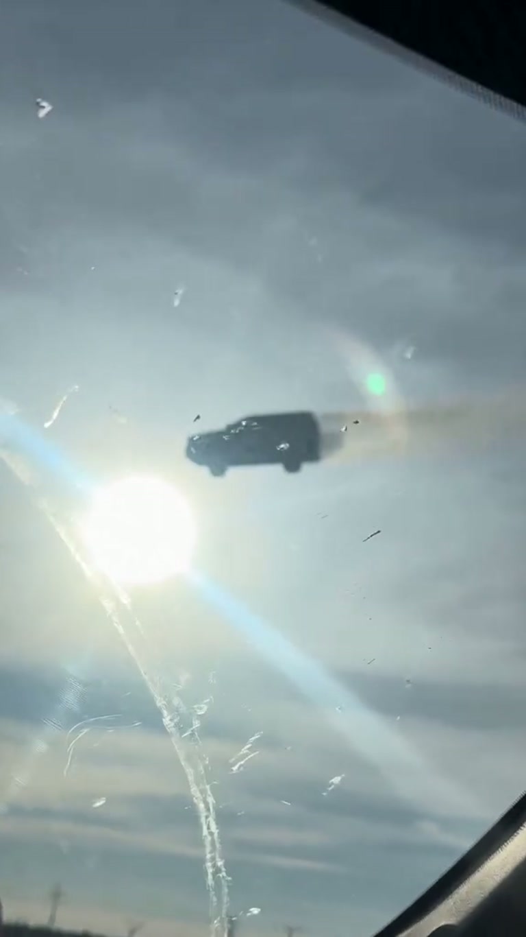 An SUV Hangs in the Clouds in a Clip Drivers Call a Glitch