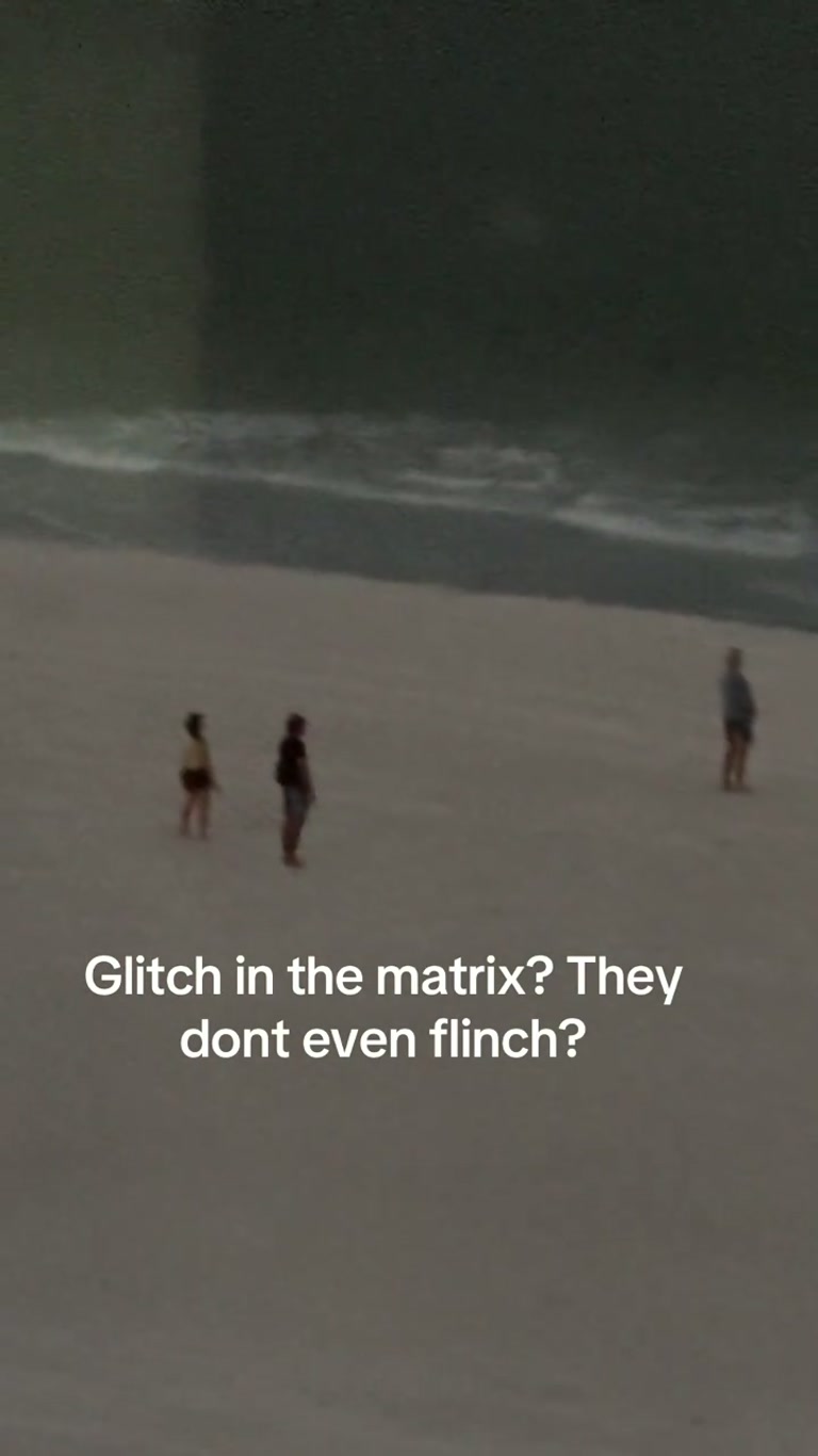 Two Figures Stand Motionless on a Night Beach and Never Flinch