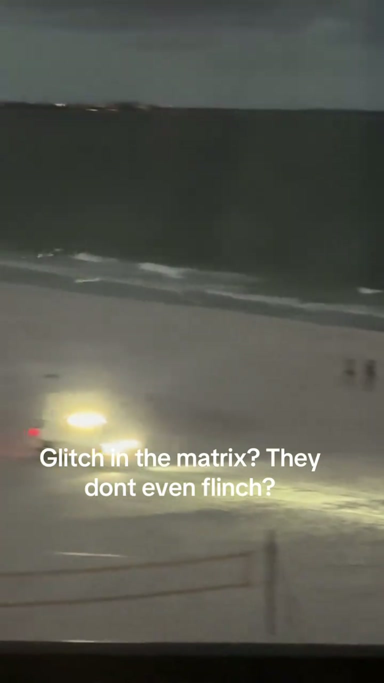 Two Figures Stand Motionless on a Night Beach and Never Flinch