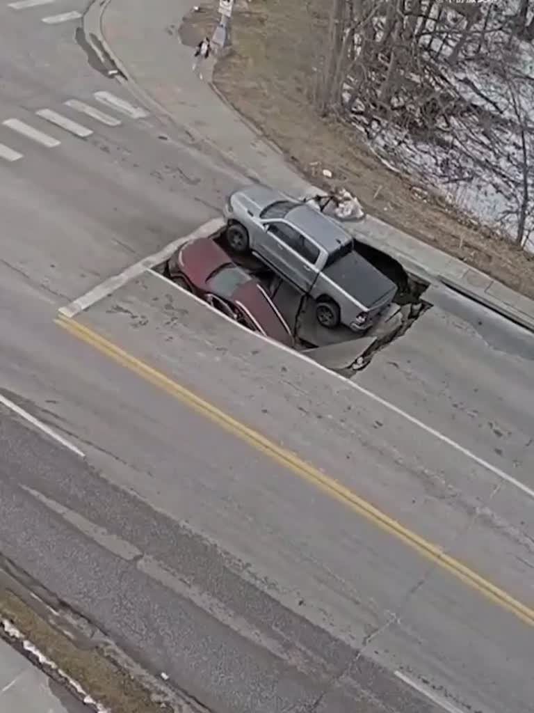 Sinkhole Swallows Car, Leaves Pickup Truck Teetering on Edge