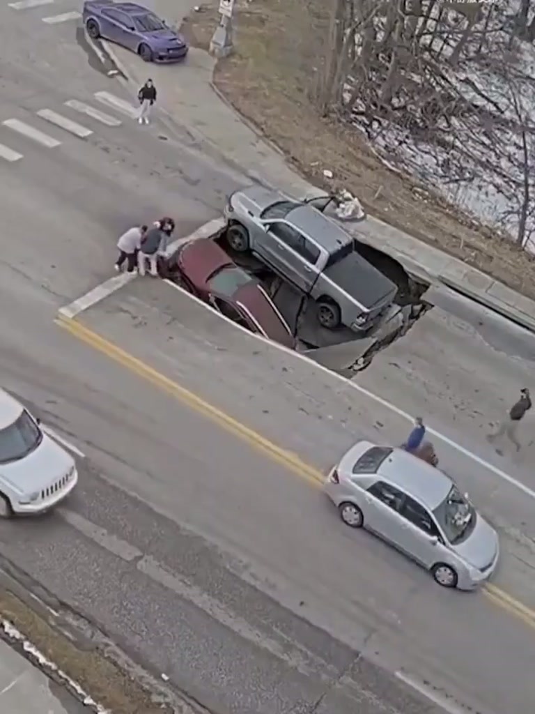Sinkhole Swallows Car, Leaves Pickup Truck Teetering on Edge