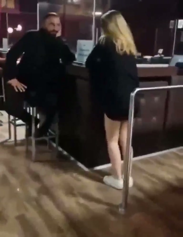 Video Shows a Woman on a Bar Floor as a Voice Repeatedly Warns Oleg