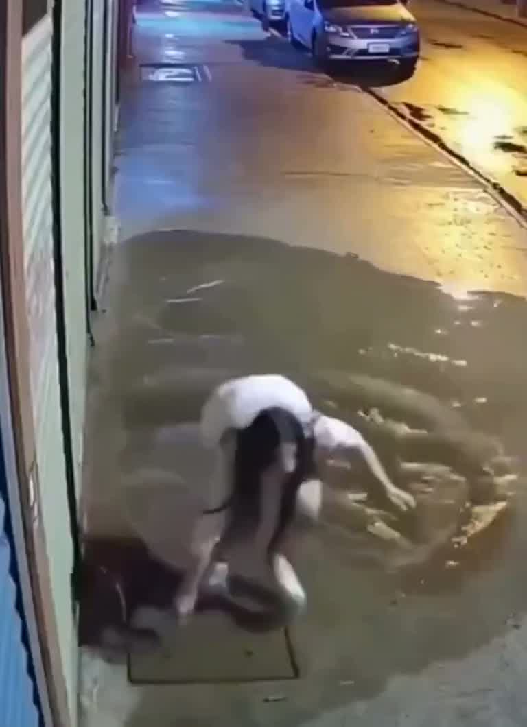 A Wet Sidewalk and One Misstep: The Fall Caught on Camera