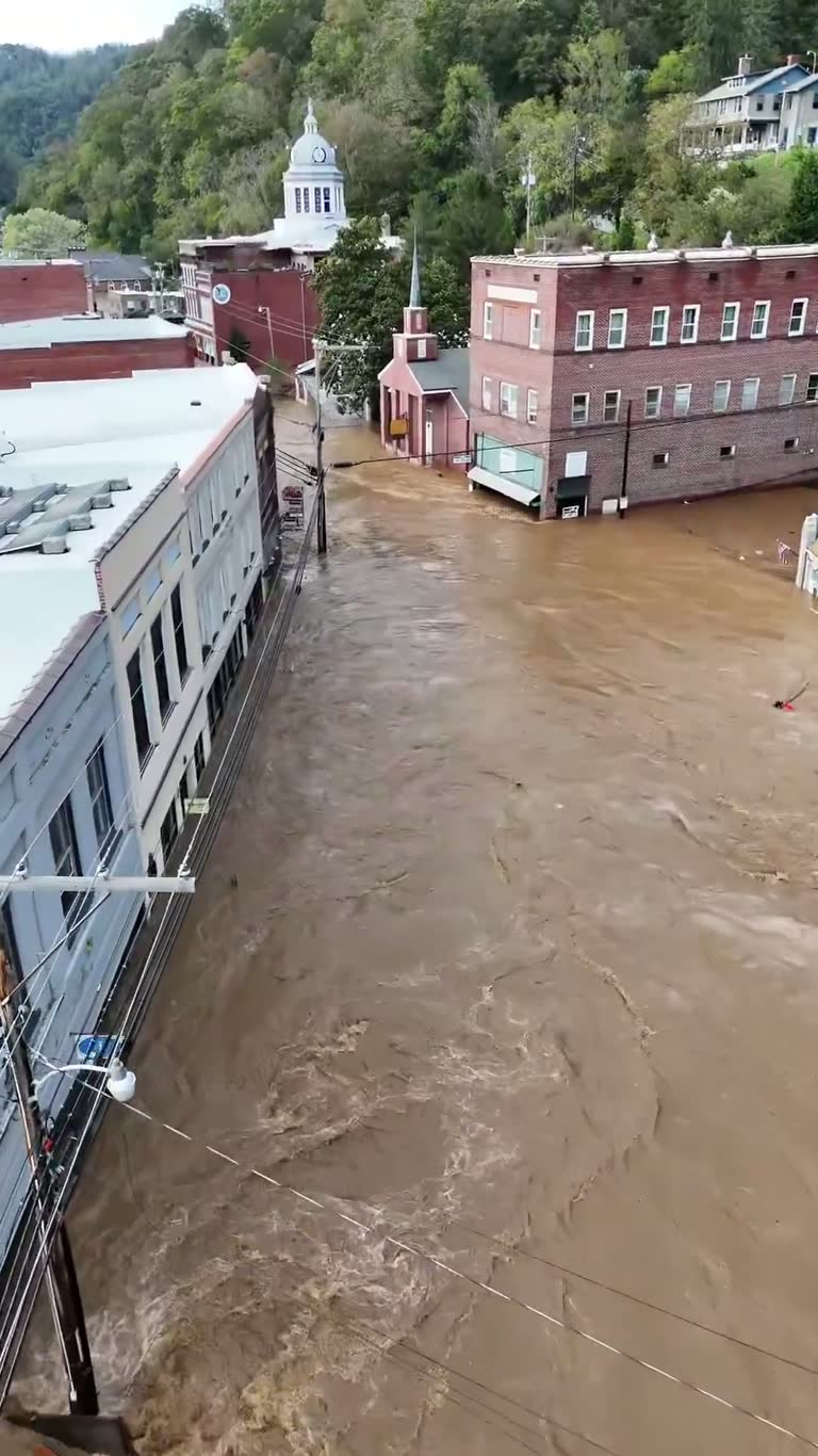 Two Years After Helene, a Downtown Street Turns Into a Brown River