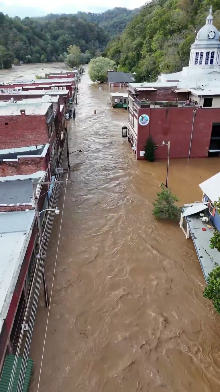 Two Years After Helene, a Downtown Street Turns Into a Brown River