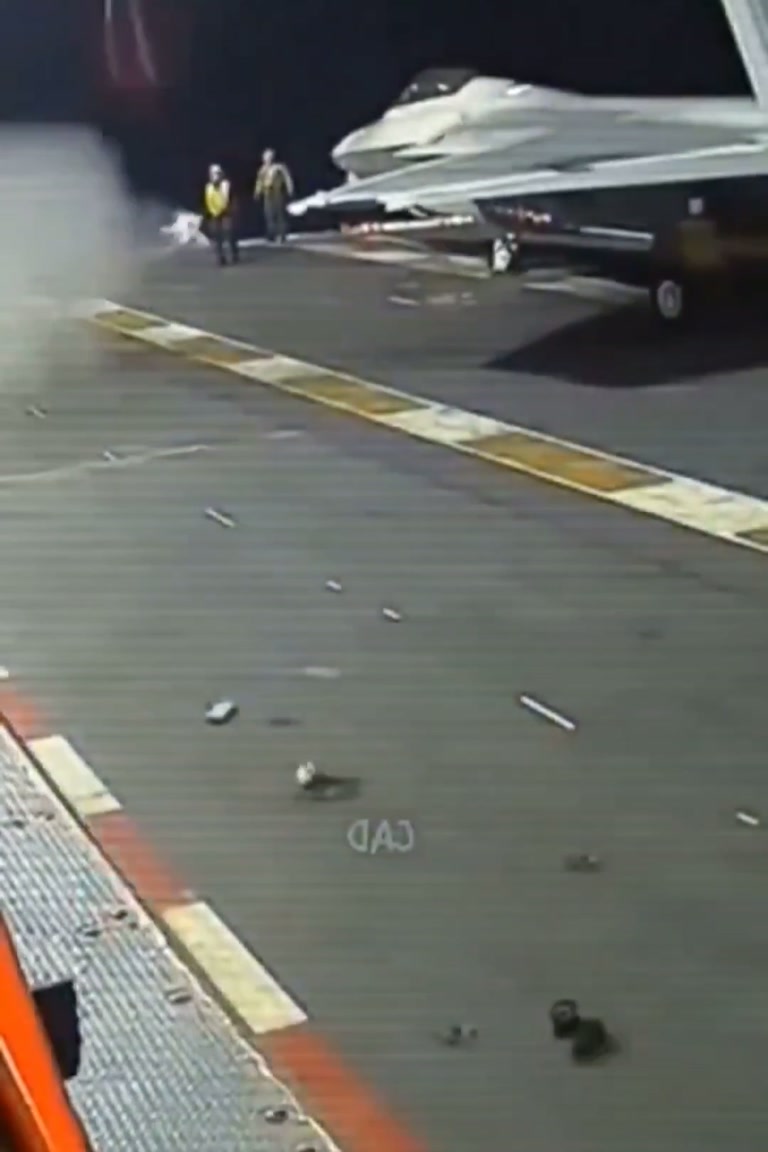 Missile Slides Across Carrier Deck as Crew Scrambles to Clear It