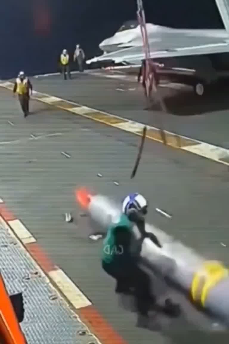 Missile Slides Across Carrier Deck as Crew Scrambles to Clear It