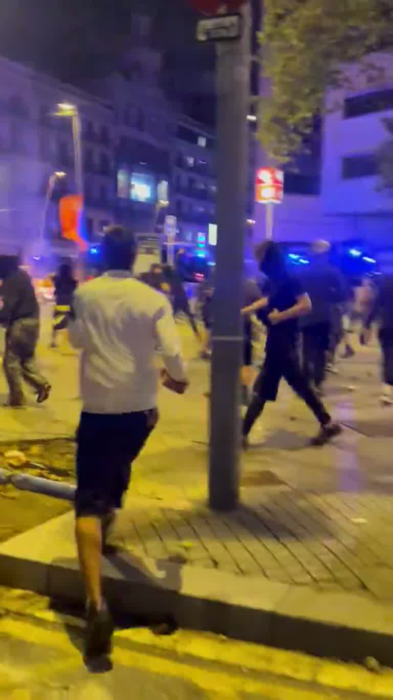 Barcelona Street Turns Chaotic as Blue Lights Flood the Night