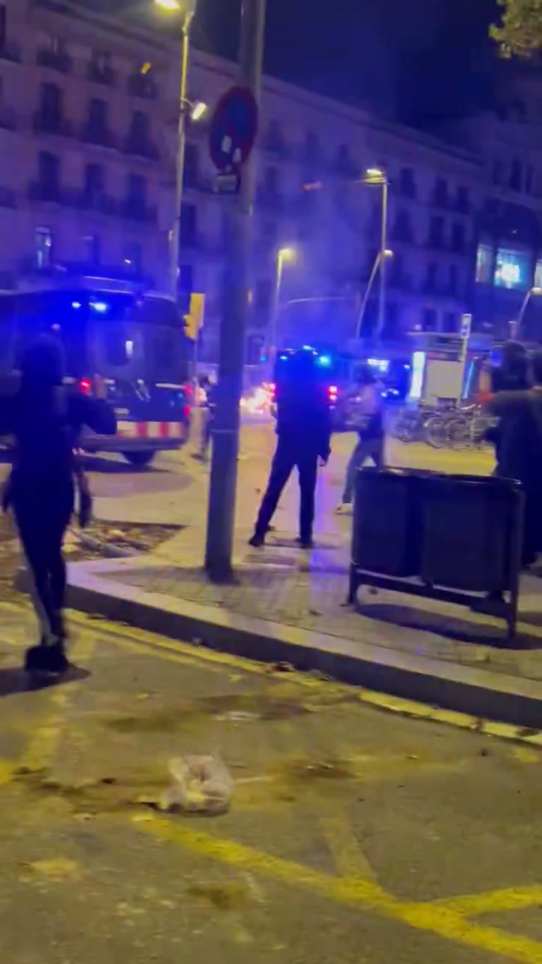 Barcelona Street Turns Chaotic as Blue Lights Flood the Night