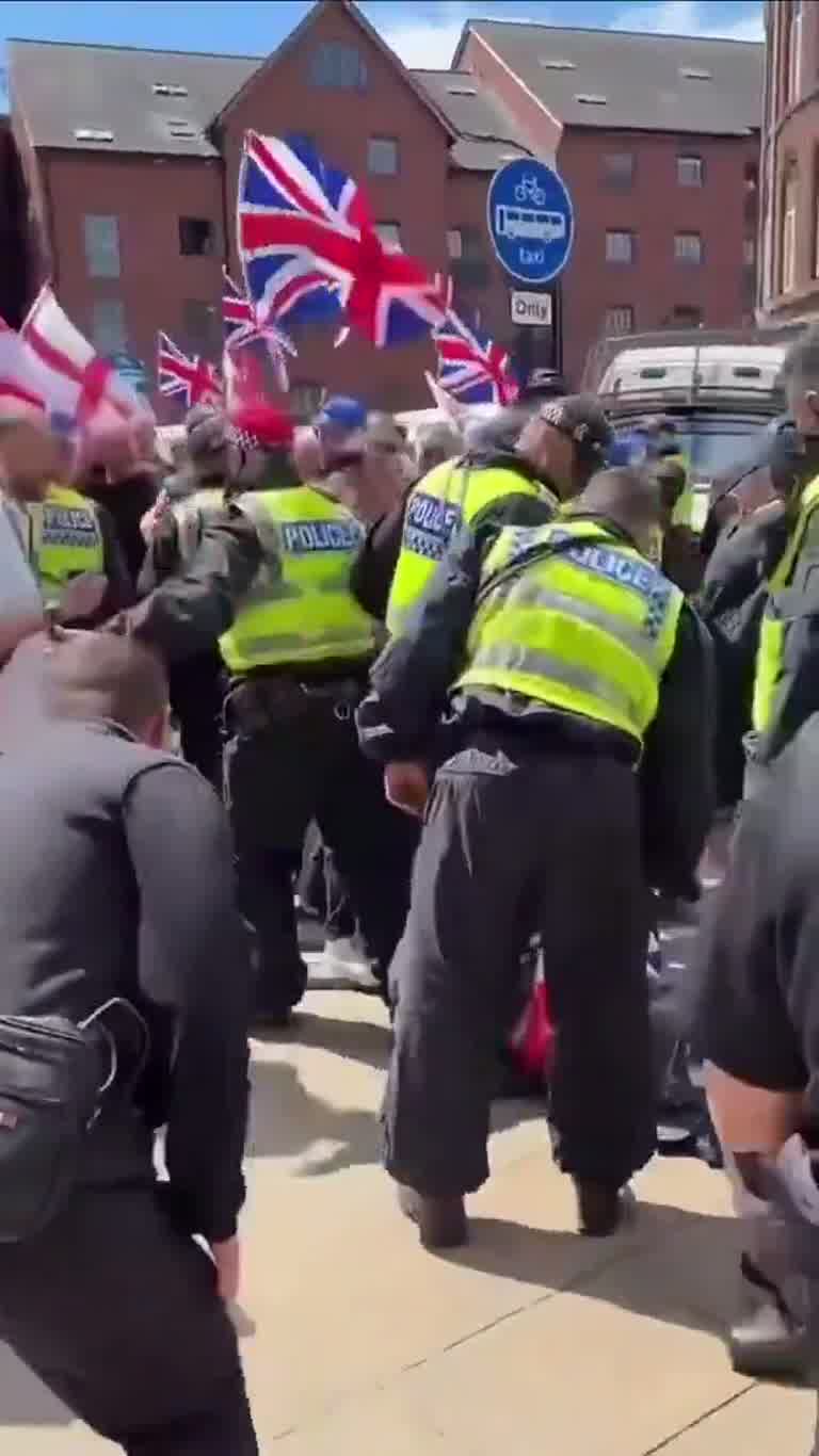 UK Street Clash: Police, a Crowd and a Man on the Ground