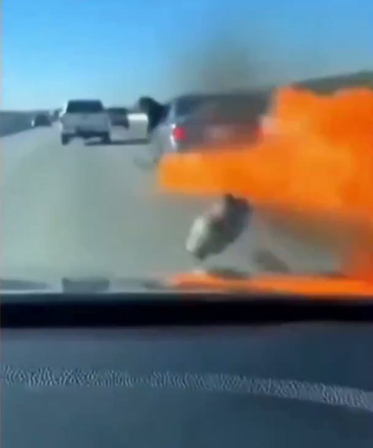 Dashcam catches flying object and orange blast on highway