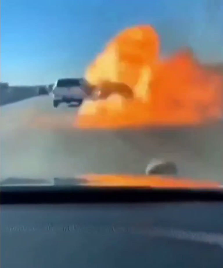 Dashcam catches flying object and orange blast on highway