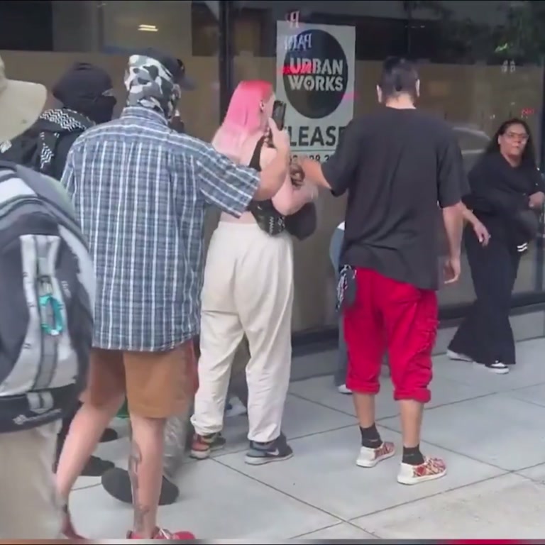 Video Shows Protest Confrontation Ending With Woman on Ground