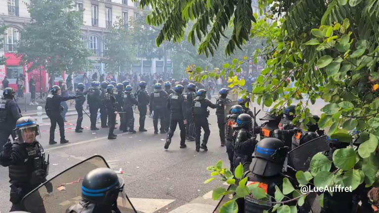 Paris Street Fills With Smoke as Riot Police Form Shield Line