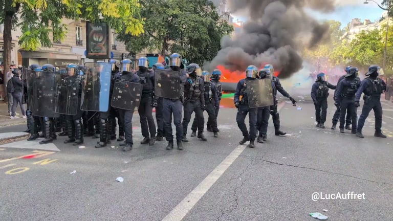 Paris Street Fills With Smoke as Riot Police Form Shield Line