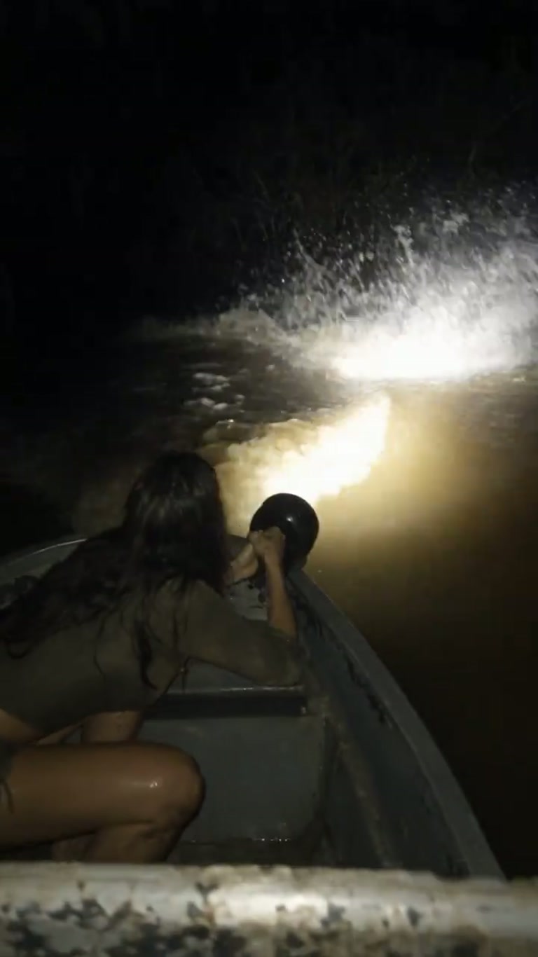 A Flashlight Beam Sweeps the Water — and Something Moves Below