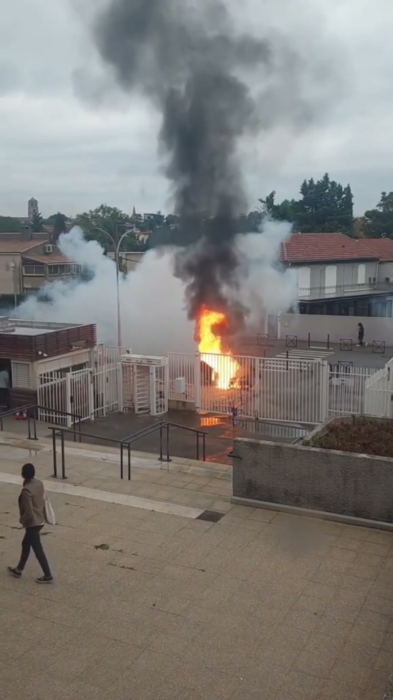 Fire and Smoke Behind White Gates: A Video Sparks a Heated Debate