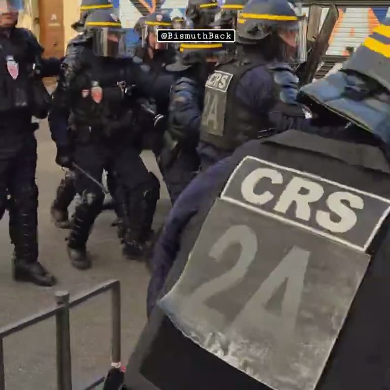 CRS Officers Charge Protesters on a Smoke-Filled Lyon Street