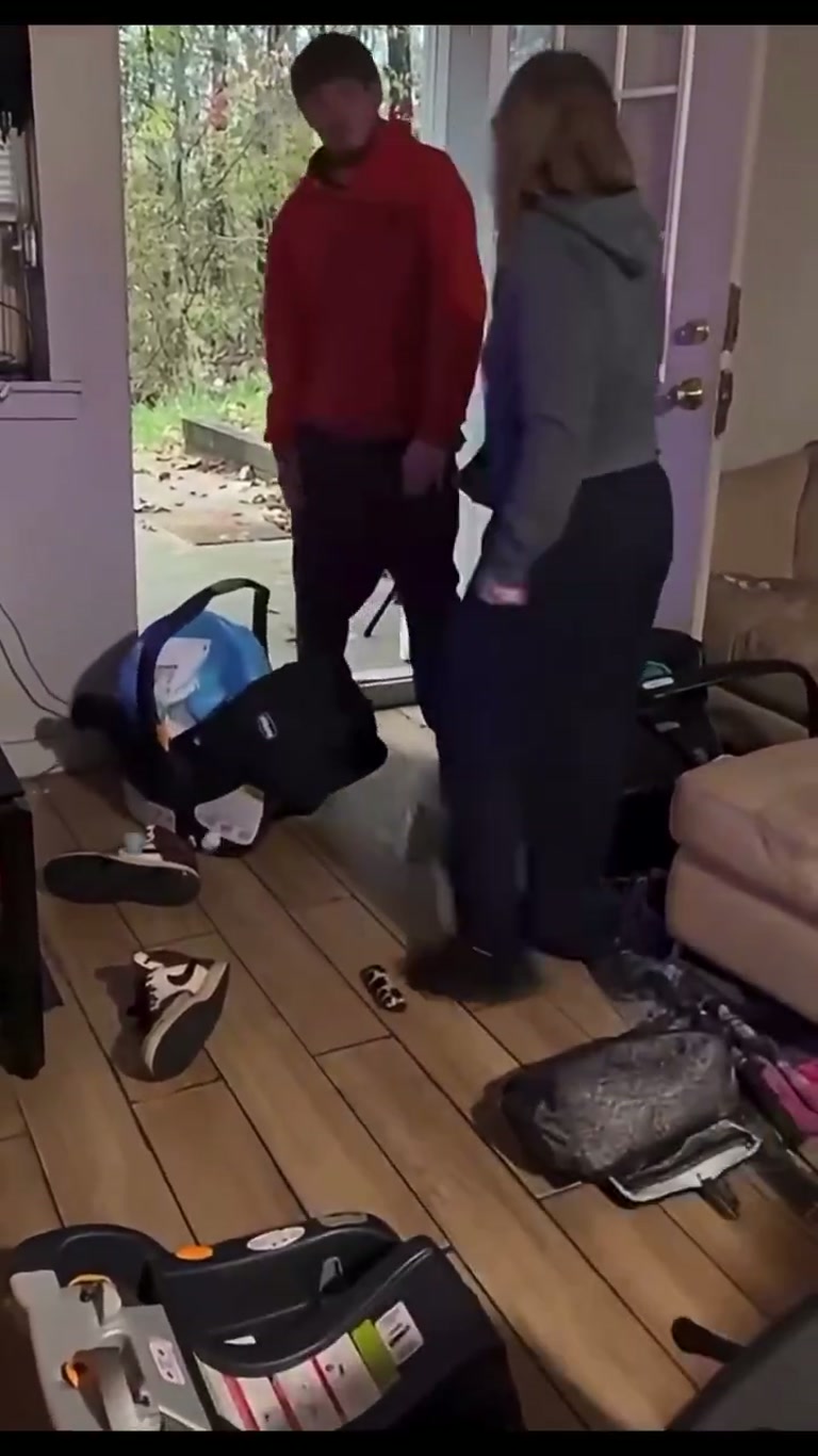 A Heated Exchange at the Door as Bags Pile Up Behind Them