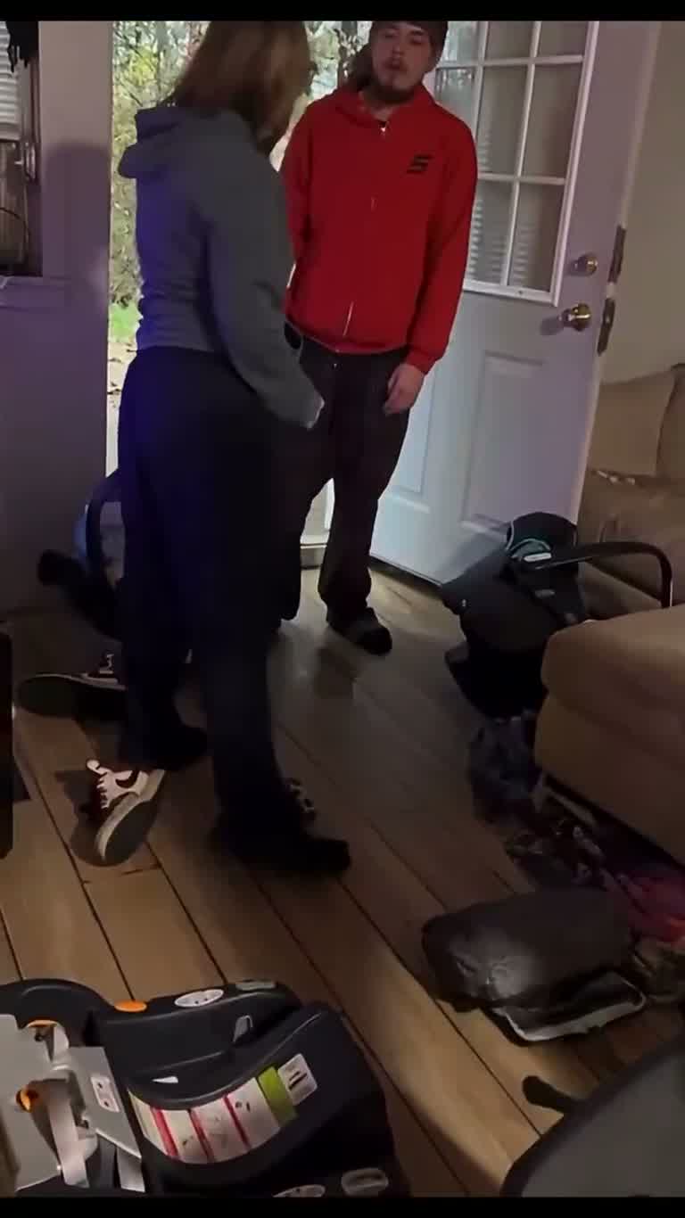 A Heated Exchange at the Door as Bags Pile Up Behind Them