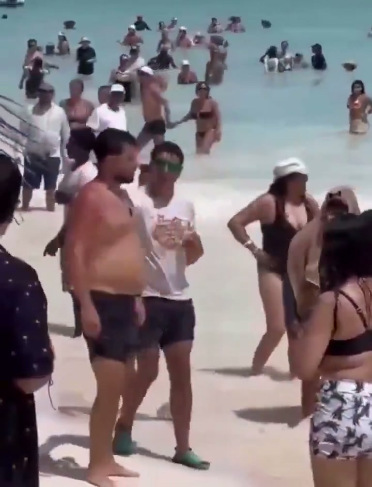 Beach Day Turns Tense as a Man Strikes a Woman in the Water
