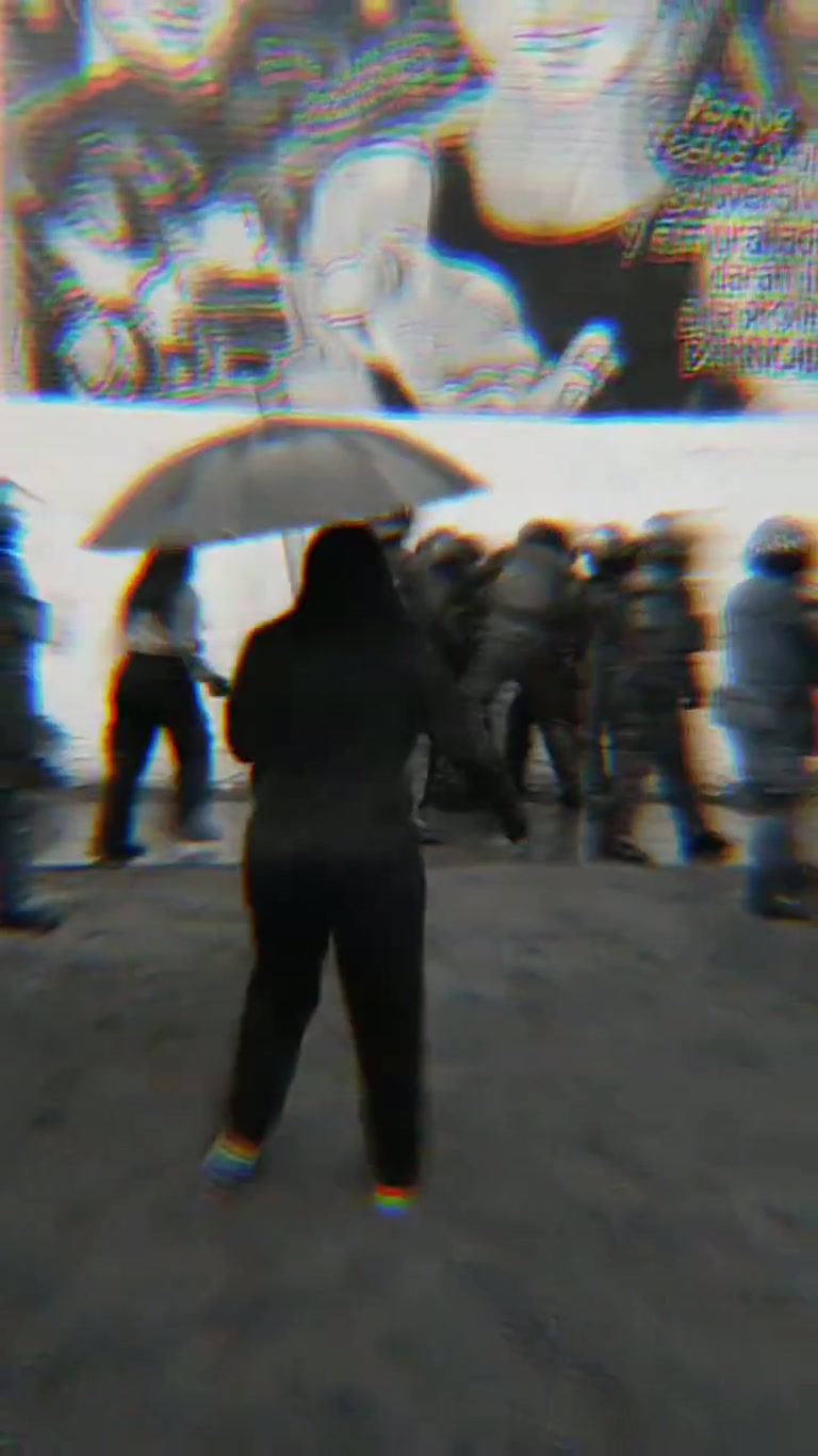 Chile March: One Man Stood Still as Police Swept Past Him