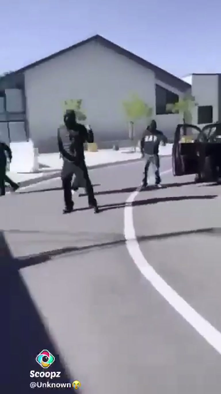 Parked SUV, a Group in Hoodies, and a Sudden Turn on a Quiet Street