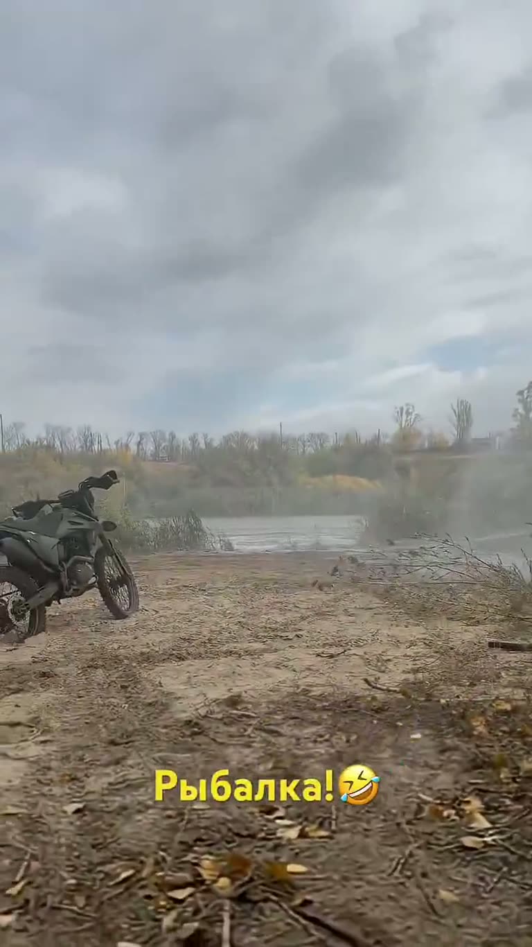 Motorcycle, Riverbank, One Thrown Object — Then a Plume Rises
