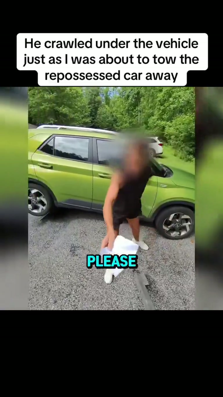 Driver Crawls Under Green Car as Repossession Crew Moves In