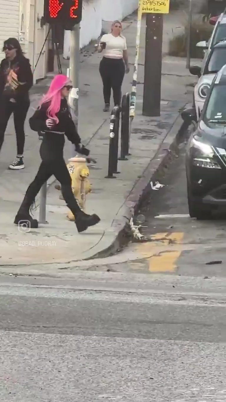 Woman Blocks SUV in the Street as Traffic Grinds to a Halt