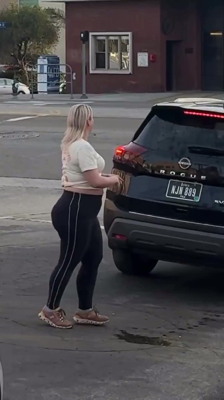 Woman Blocks SUV in the Street as Traffic Grinds to a Halt