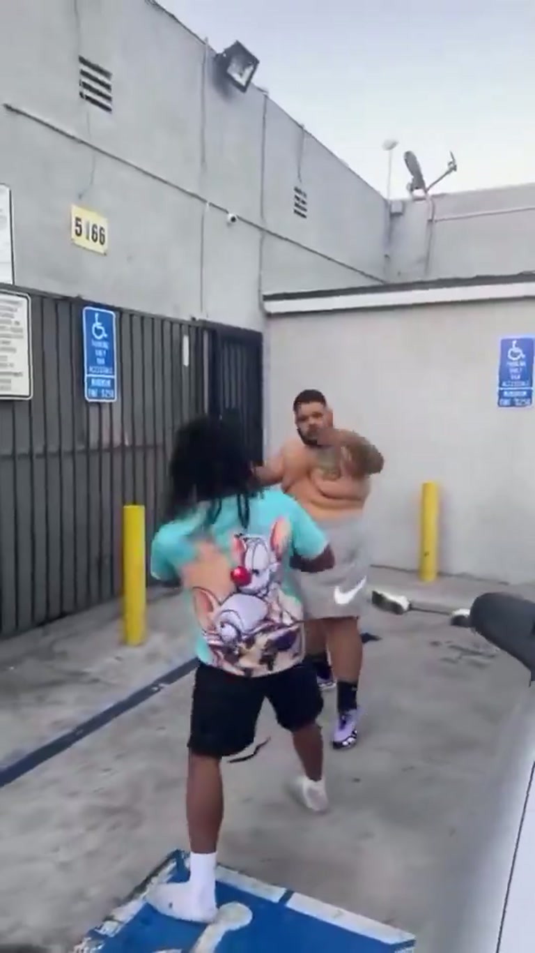 A Shirtless Man, a Smaller Rival, and a Tense Parking Lot Standoff