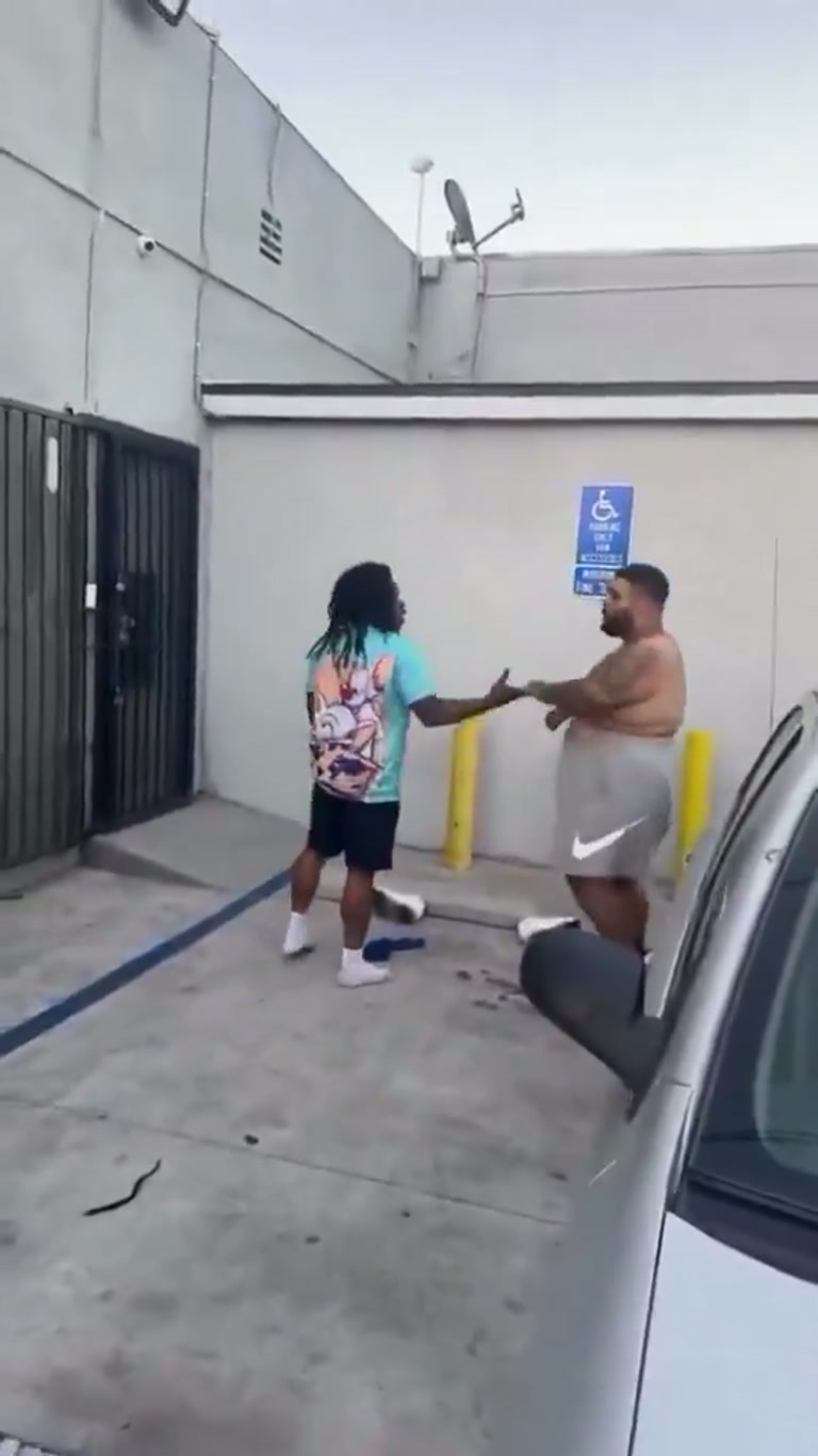 A Shirtless Man, a Smaller Rival, and a Tense Parking Lot Standoff