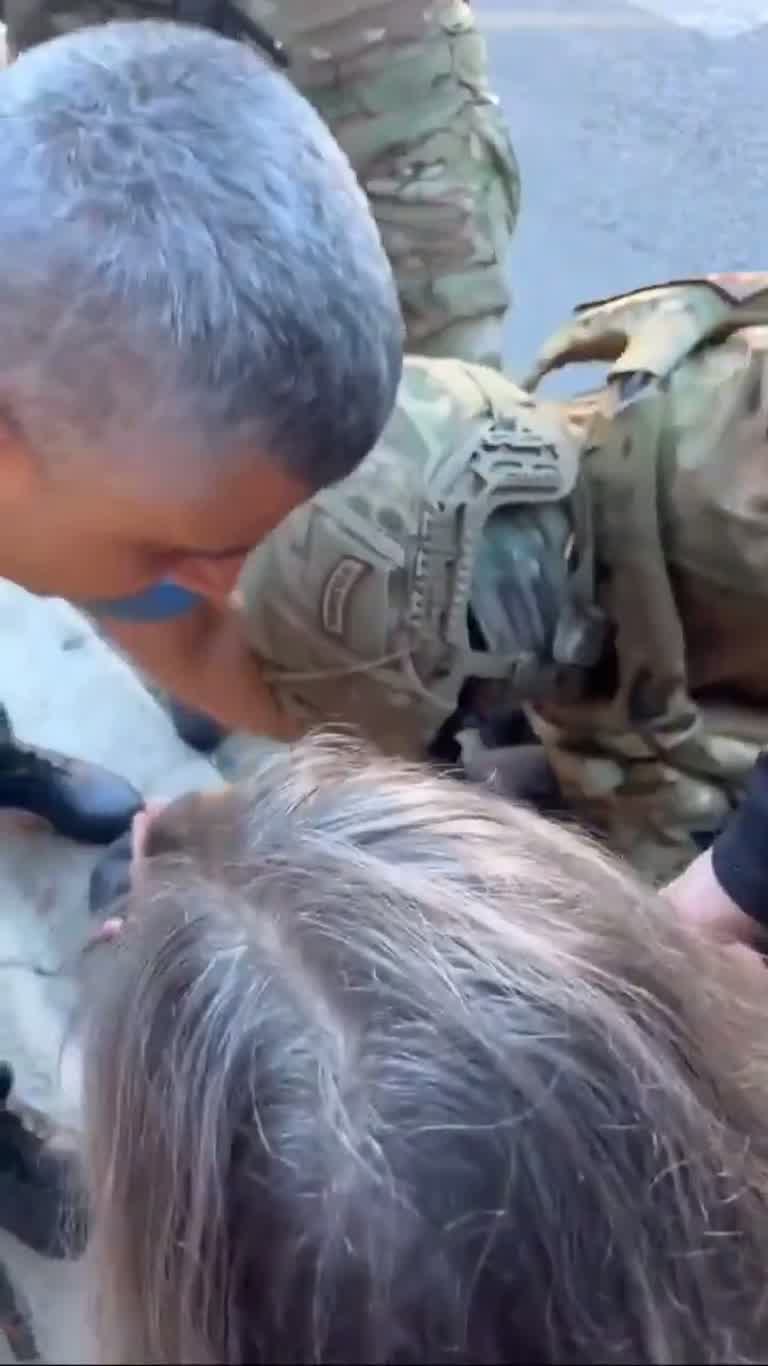 Video Shows Camouflage-Clad Group Restraining People on Street