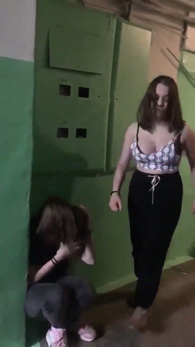A Green Stairwell, Two Women, and One Moment Nobody Explains