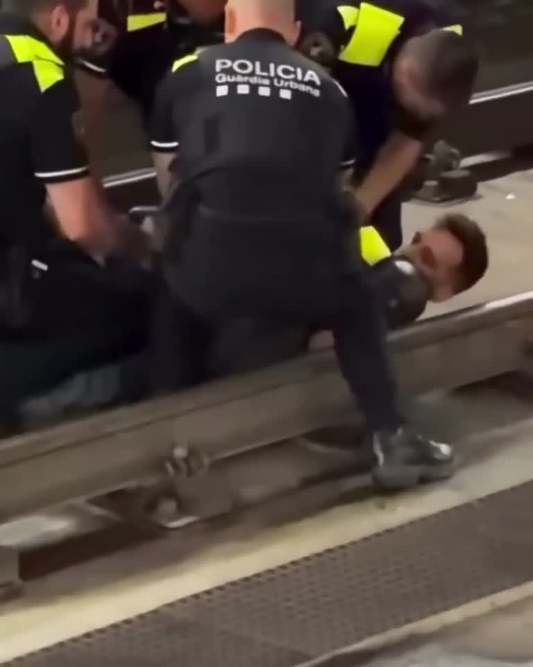 On the Tracks Below a Quiet Platform, Officers and One Calm 'Yes, Sir'