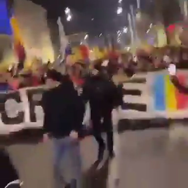 A City Fills With Flags at Night — and Nobody Is Leaving