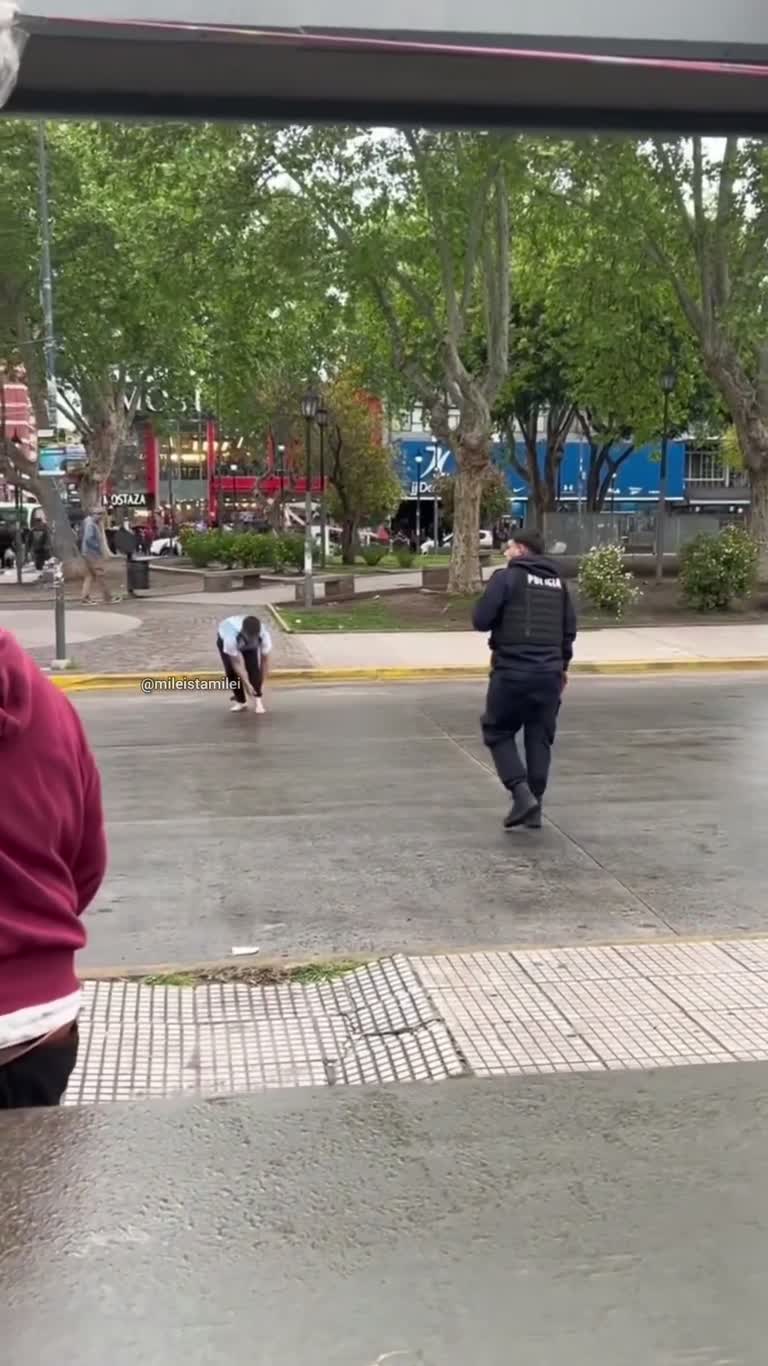On a Rain-Slick Corner, a Street Vendor's Stall Falls Apart
