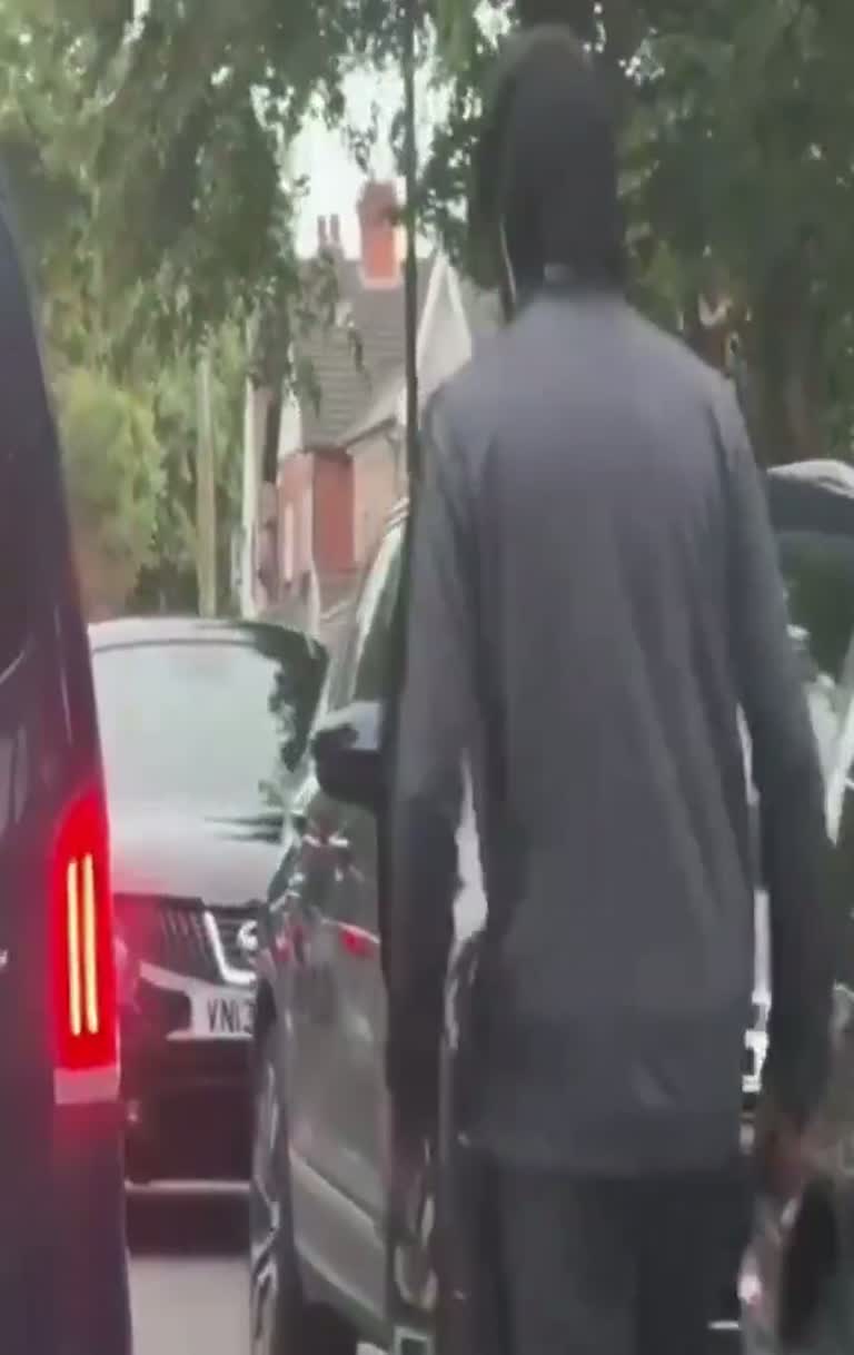 A Live Report, a Quiet Street, and One Detail by the Van