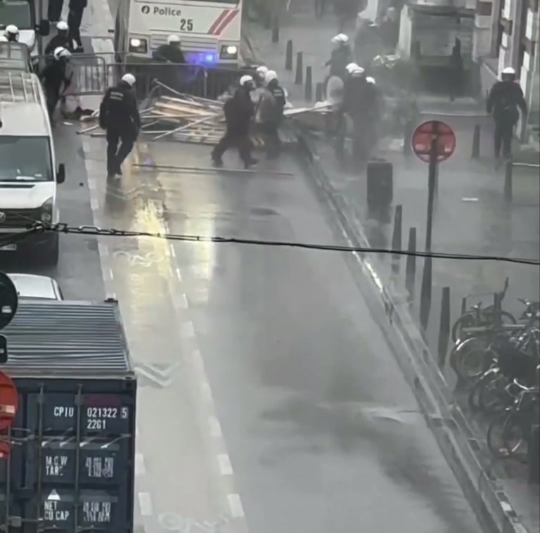 A Quiet Window, a White Jet of Water, and a Street That Turns