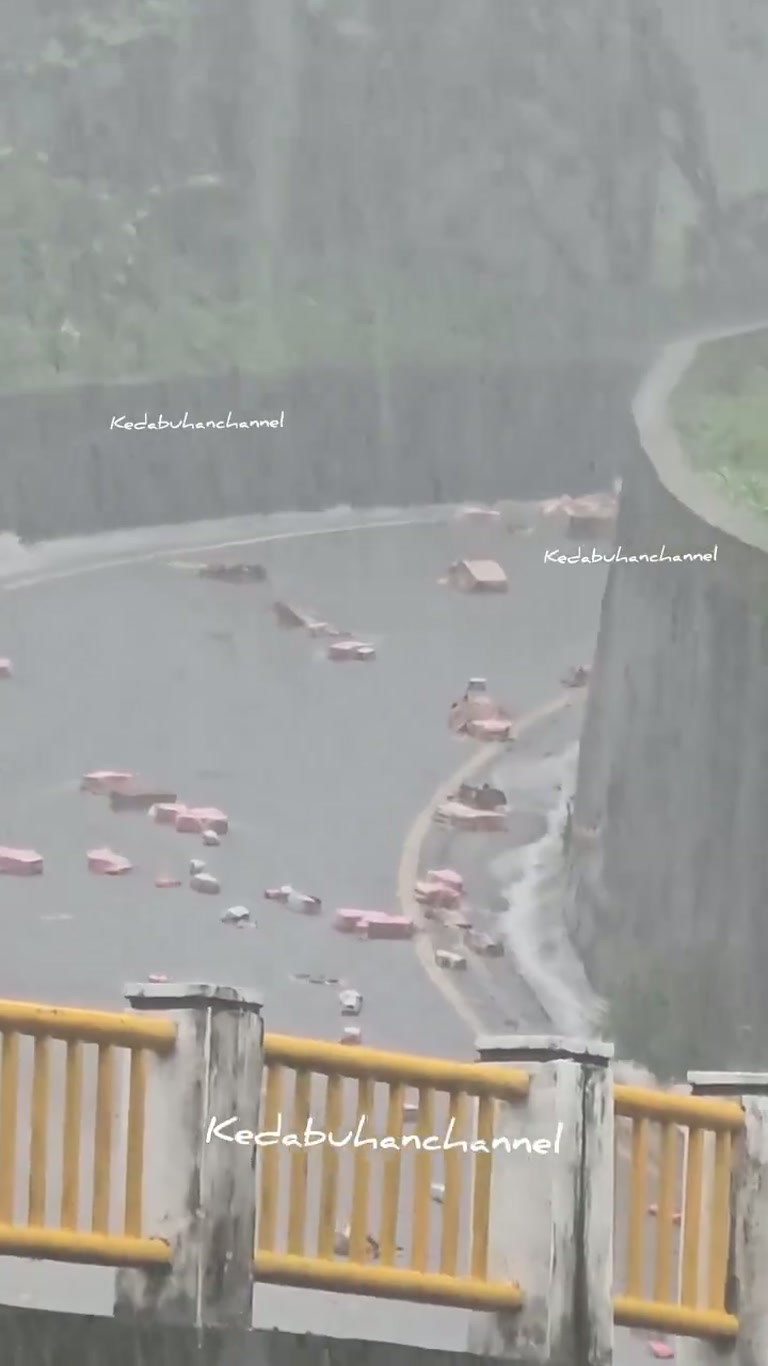 A Man Runs for His Life as a Wall of Water Swallows the Street