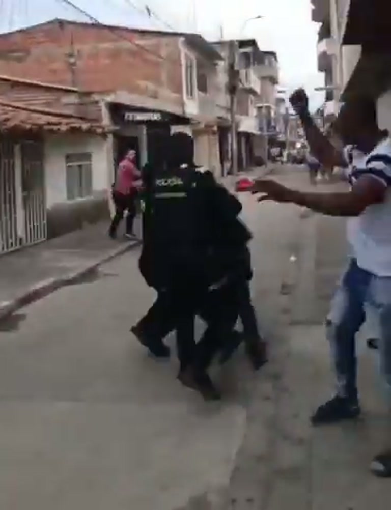 A Man Swings at a Police Officer and a Quiet Street Erupts
