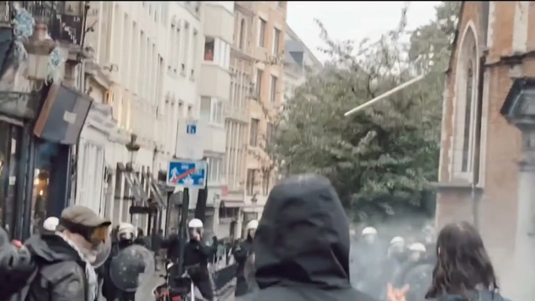 A Daytime March Fills the Square, Then the Smoke Rolls In
