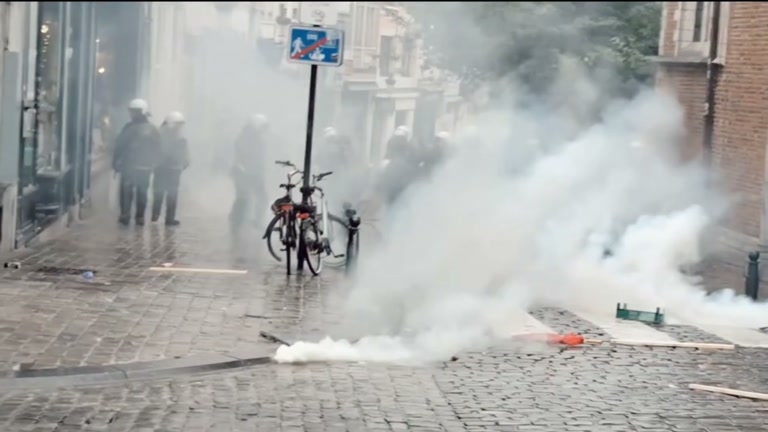 A Daytime March Fills the Square, Then the Smoke Rolls In