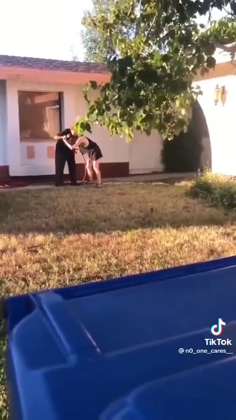 Neighbor Dispute on a Quiet Lawn Ends in a Tangle on Camera