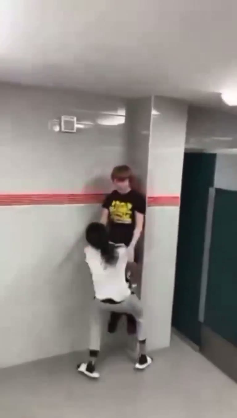 Caught Off Guard: Sudden Confrontation in a Quiet Hallway