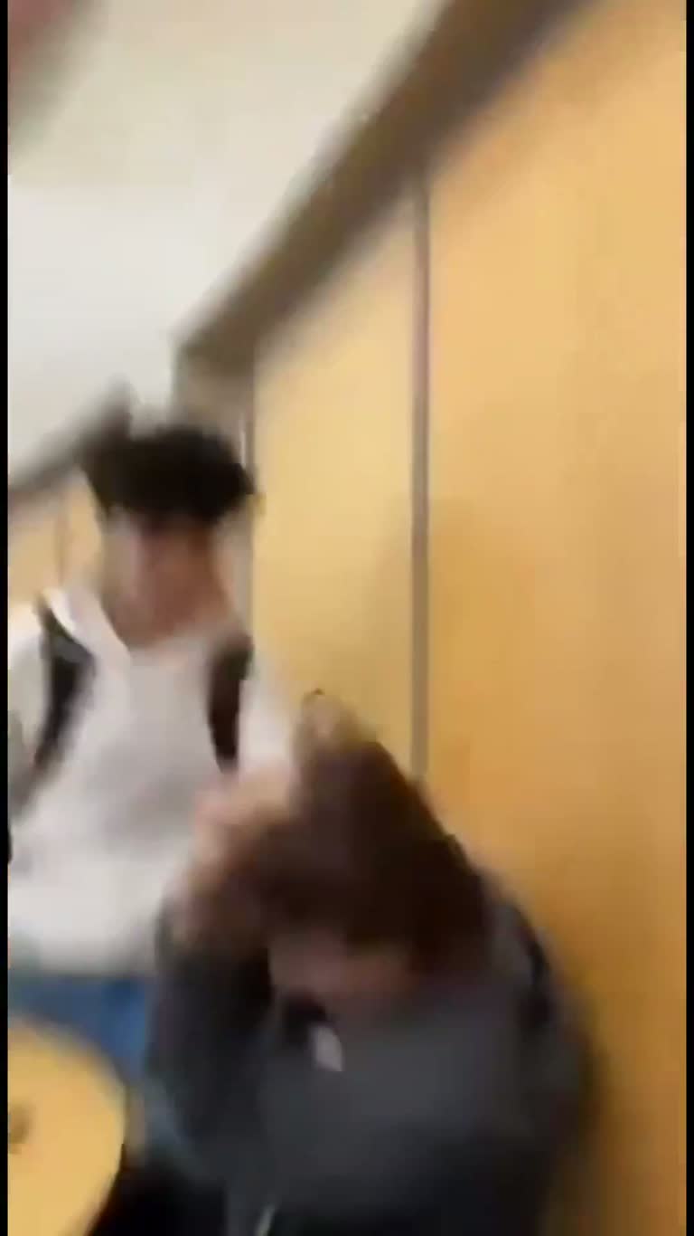 Student catches sister's abusive ex in cafeteria and a scuffle breaks out