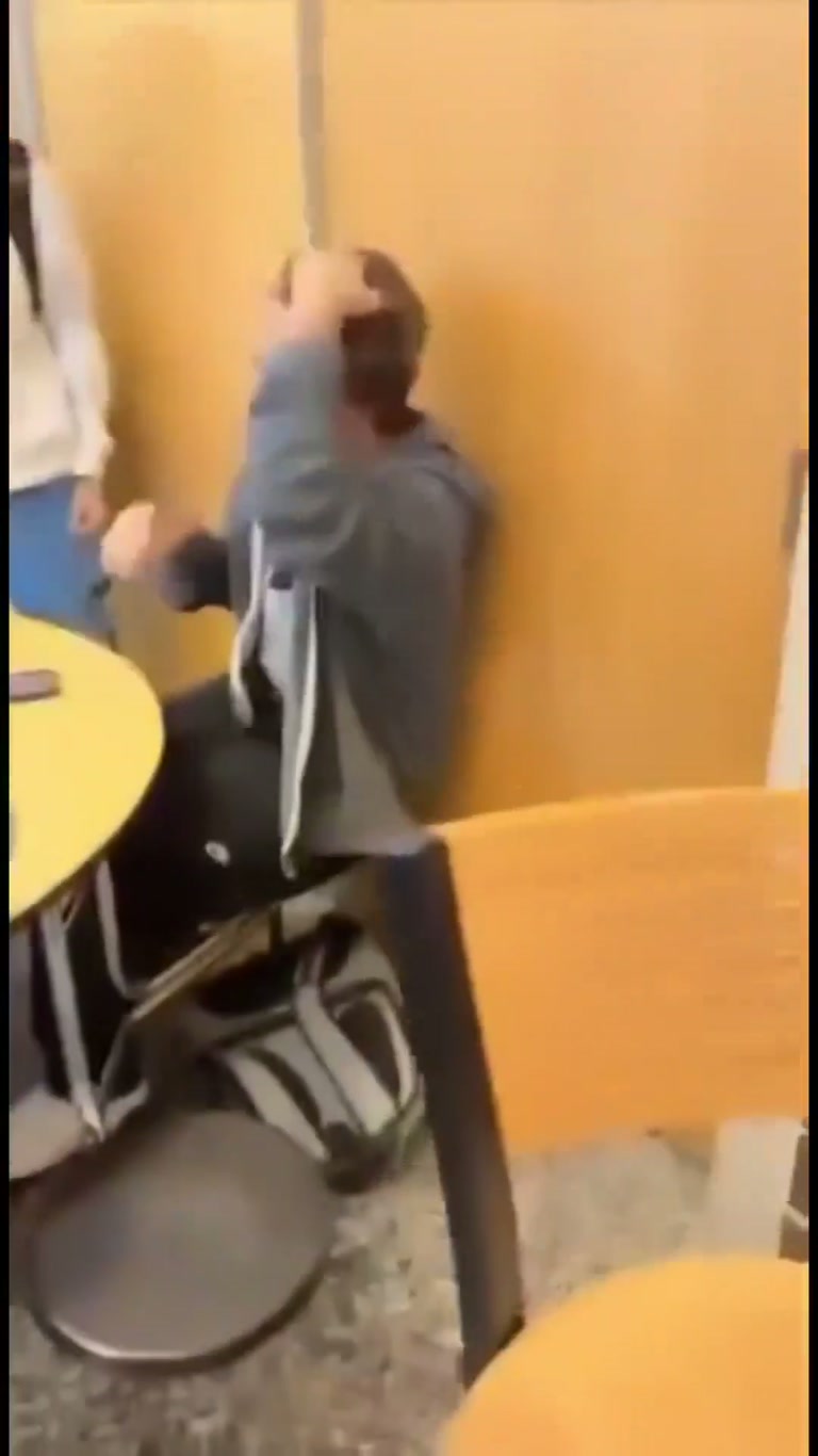 Student catches sister's abusive ex in cafeteria and a scuffle breaks out
